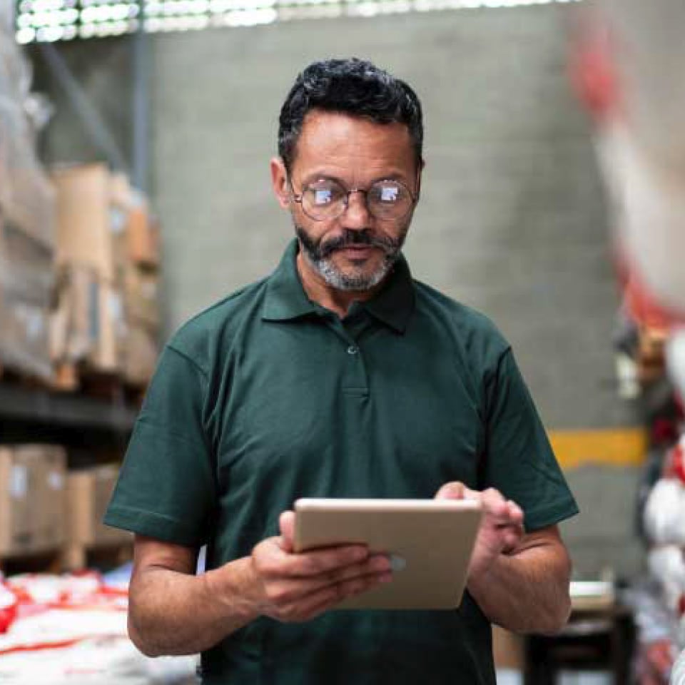 shop manager looking at mobile device