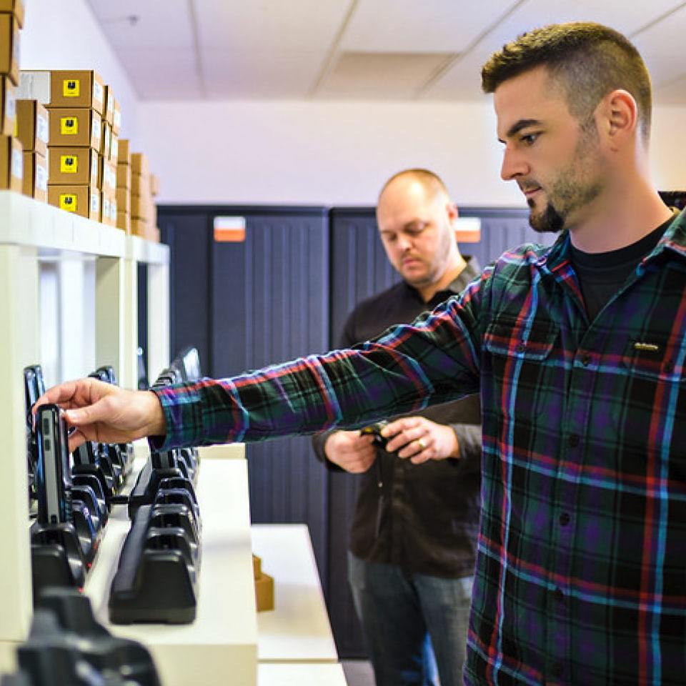 two-men-looking-at-hand-held-scanners