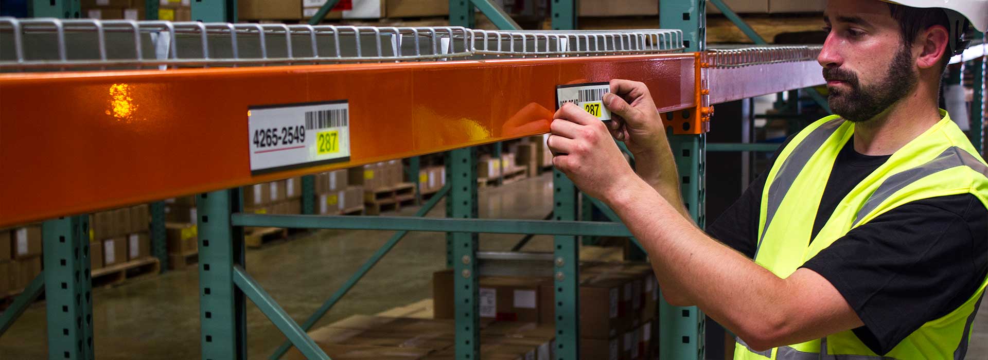 applying_label_to_warehouse_racking