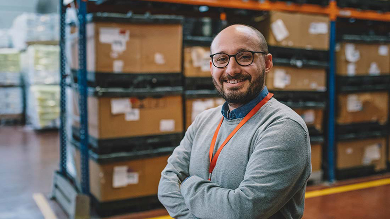 chief-operating-officer-in-warehouse-smiling