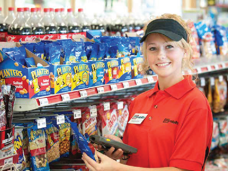 Mirabito employee scanning products in from of a store shelf